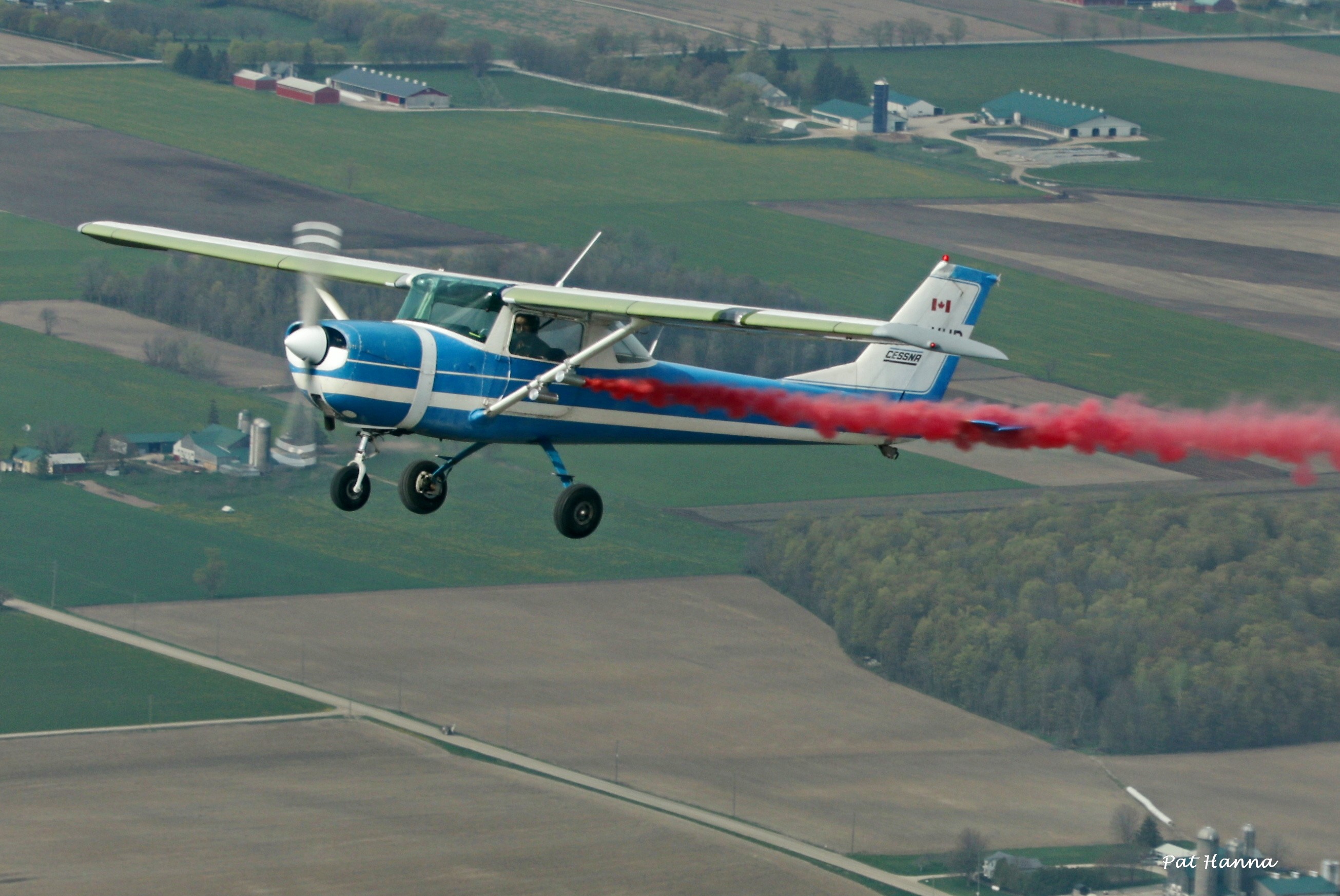 Cessna with red smoke display